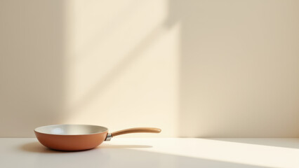 A rustic copper skillet on a wooden table with sunlight streaming through a window.