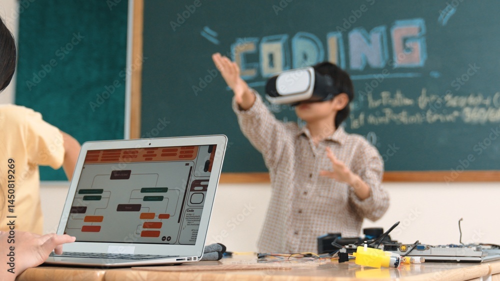 Poster asian boy wearing vr headset to enter metaworld at table with electronic board while girl coding sys