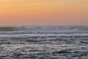 Rippling waves dance beneath a sherbet sky, evoking Nakarat time, an ancient sea tribute, and...