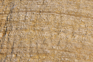 Patterns in tan colored rocks.