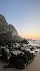Mossy rocks bask under the golden-hour glow, evoking Earth Day meditations and coastal cleanup...