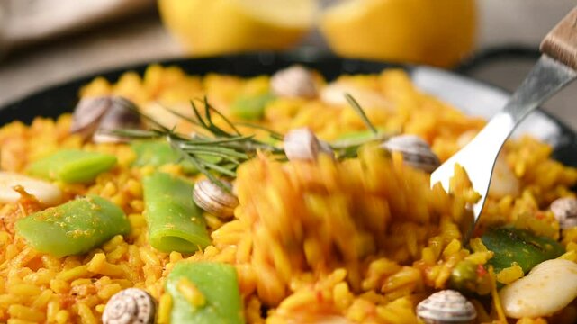 Traditional Valencian paella with chicken and rabbit. Close up