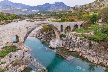 The historic stone arch Mesi Bridge over the Kir River.