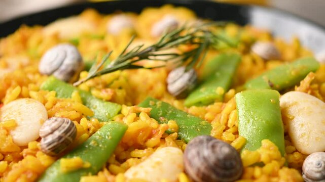 Traditional Valencian paella with chicken and rabbit. Close up