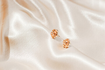 Elegant earrings displayed on soft fabric create a stunning visual for jewelry enthusiasts