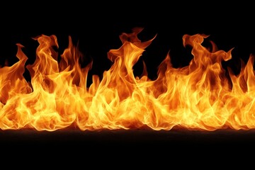 Fototapeta premium Fiery flames burning intensely against black background, ideal for design elements