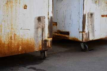 Dumpsters rusted out from bottom. 