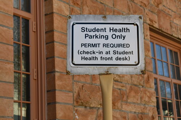 Student Health Services parking only sign. Permit required.