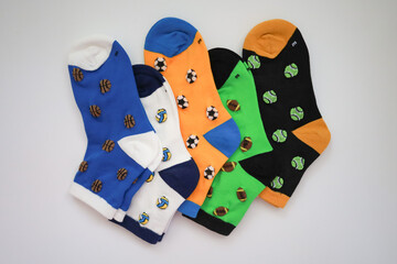 5 Children's Bright Pairs of Socks on a White Background