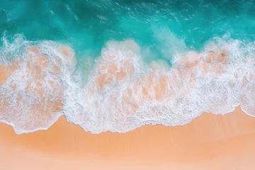 Selbstklebende Fototapeten Waves gently crash on a golden sand beach under the bright blue sky during a sunny afternoon © vasyl pshyk