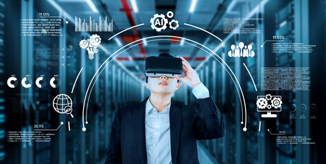 Businessman with headset standing at data center while using AI assistance. Project manager looking hologram and using augmented reality goggles and AI chat for planning marketing strategy. Ingenuity.