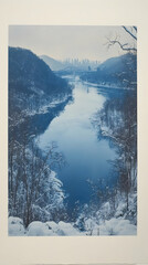 Winter river landscape, high angle view of a serene river winding through a snow-covered valley