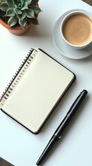 Minimalist workspace featuring open notebook, coffee, pen and succulent plant