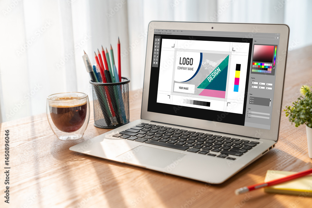 Poster graphic designer software for modern design of web page and commercial ads showing on the computer s