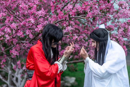 Boys goofing off in traditional Asian outfits