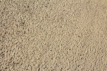 Close-up Texture of Fine Sand with Detailed Natural Pattern and Tiny Grains