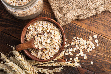 Oat flakes, dry oatmeal or rolled oats - healthy dietary fiber food for breakfast or cooking