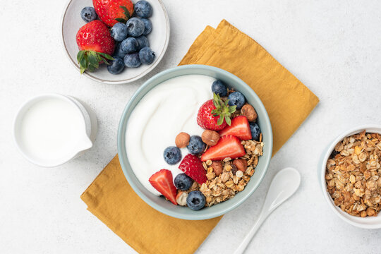 Greek yogurt bowl with crunchy granola and berries