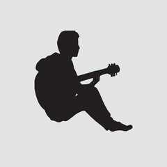 silhouette of a man with a guitar