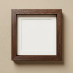 Fototapeta premium Square brown wooden frame with white matte hanging on neutral wall