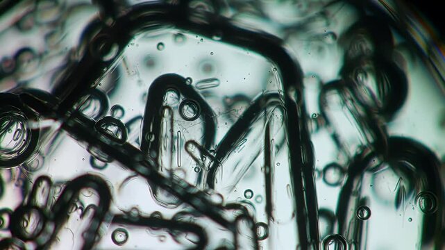 Abstract Flowing Liquid and Bubbles Close Up