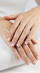 Naklejka premium Elegant French Manicure: Perfect Nails, Clean Beauty & Hand Care Tips for a Classic Style on a Towel Background!