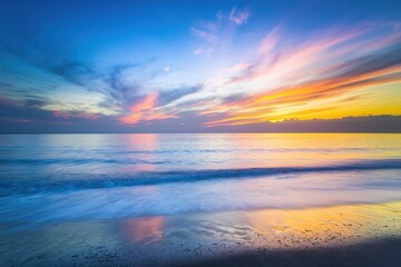 Fototapeta premium Beautiful Beach Sunset: Colorful Sky Reflected on Ocean Waves at Dusk.