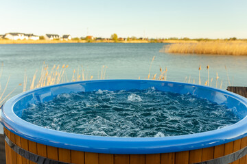 Outdoor hot tub near lake. Jacuzzi bubbles