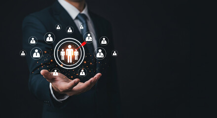 A businessman holding a team of people icon with a dark background in a suit and tie image selling, purchasing, agreement, $
