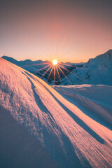 Golden Sunset over Snowy Slopes at Trittkopf