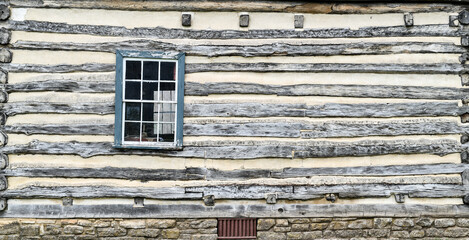 Old weathered wood barn wall, door and window
