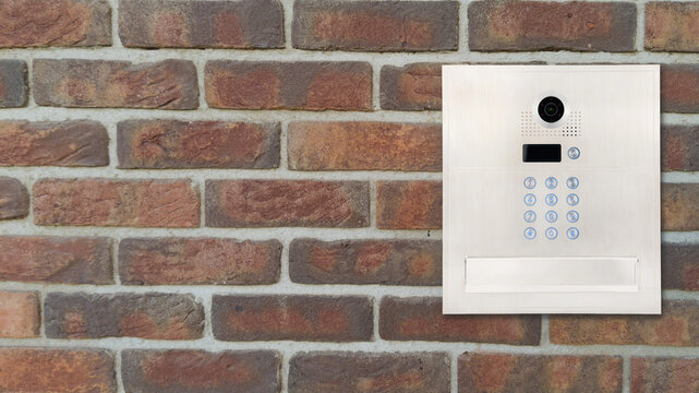 Modern Intercom Panel on Brick Wall