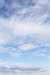 Beautiful epic soft gentle blue sky with white cirrus and fluffy clouds background texture