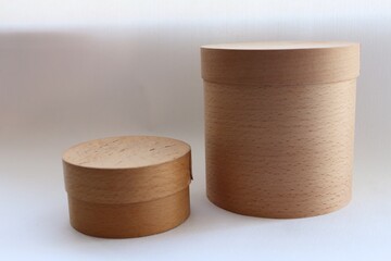Close-up of wooden tubes, on a white background, wooden boxes, eco-packaging 