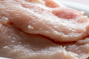 raw chicken fillets and vegetables garlic,tomato