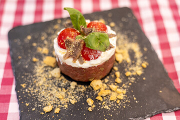 Beef tartare with anchovies, tomatoes and burrata cheese