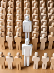 Obraz premium Diverse wooden figures stand opposite a uniform group, separated by a single white figure. Illustrates individuality, difference, and unity.