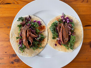 Healthy lunch with anchovies, greens, purple cabbage and hummus
