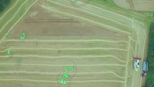 Digital agriculture animating over tractor pulling trailer with farmers and floating green icons