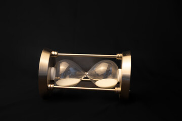 hourglass on black background