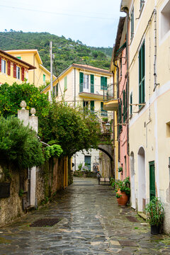 Colorful houses with large windows and narrow street. Monterosso, Cinque Terre, Italy