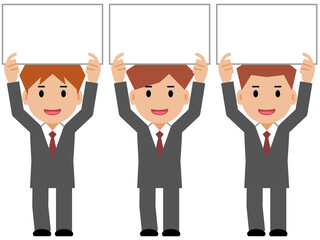 ボードを掲げるグレースーツの若い男性