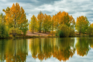 View of Kellands Pond , and its vibrant autumn colour at an arm  of Lake Ruataiwha, Twizel great...
