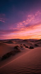 Fototapeta premium Psychedelic sunset over desert dunes with warm lighting and negative space on left