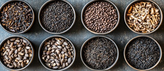 Assortment of aromatic culinary spices displayed in metallic bowls for gourmet cooking