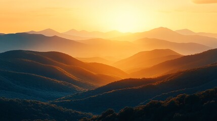 Fototapeta premium Layered mountain silhouettes fading into the distance with warm golden hour light 