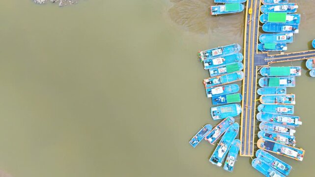 A beautiful aerial drone view of the exposed tidal mudflats during low tide on the west coast of South Korea &mdash; showcasing the serene and expansive coastal landscape of nature