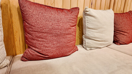 Cozy cushions arranged neatly on a stylish sofa in a warm setting