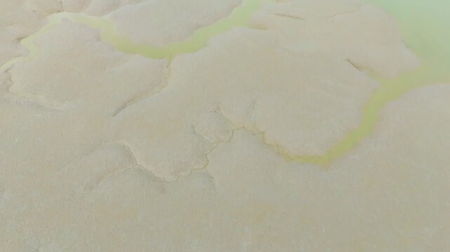 A beautiful aerial drone view of the exposed tidal mudflats during low tide on the west coast of South Korea &mdash; showcasing the serene and expansive coastal landscape of nature