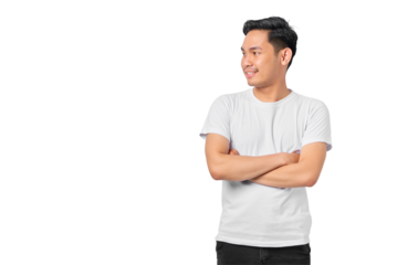 Portrait of smiling young Asian man crossed arms and looking aside at blank space isolated on transparent background